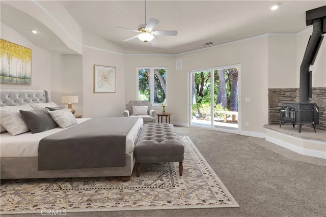 a spacious bathroom with a granite countertop sink a mirror and a bathtub
