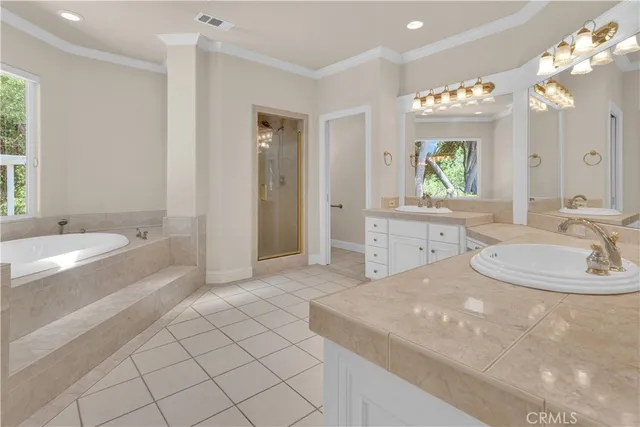 a bath tub sitting in a bathroom next to a window