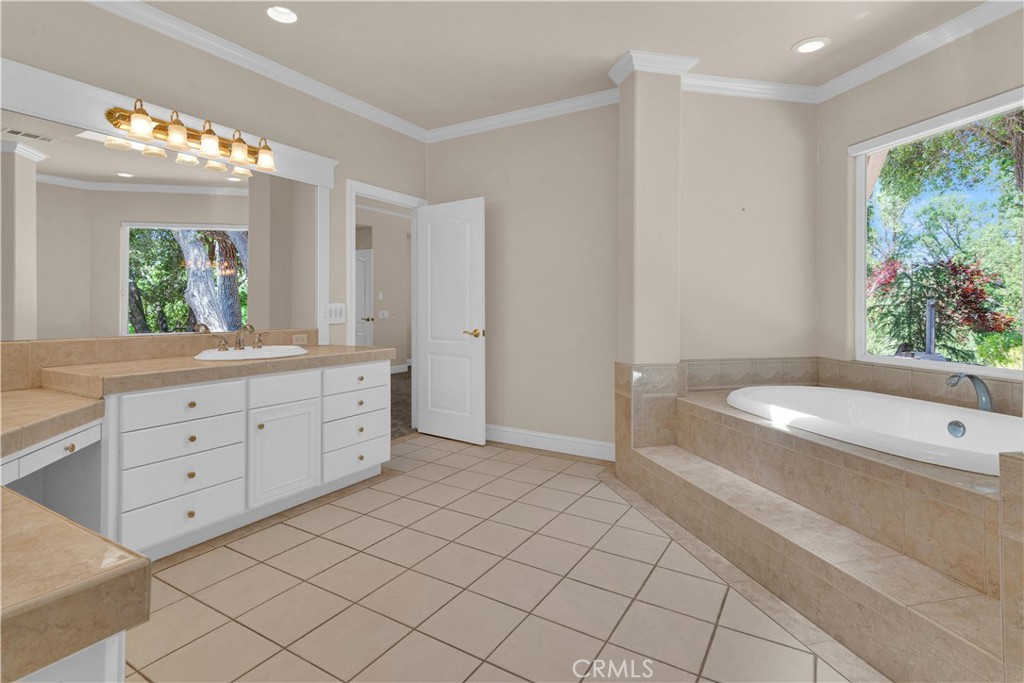 117 Frontier Way Templeton, CA 93465 - Photo 30 of 60 a spacious bathroom with a granite countertop sink mirror and bathtub