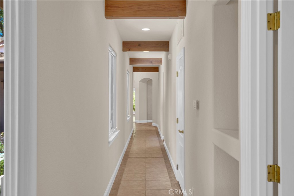 117 Frontier Way Templeton, CA 93465 - Photo 34 of 60 a view of a hallway with wooden floor and door