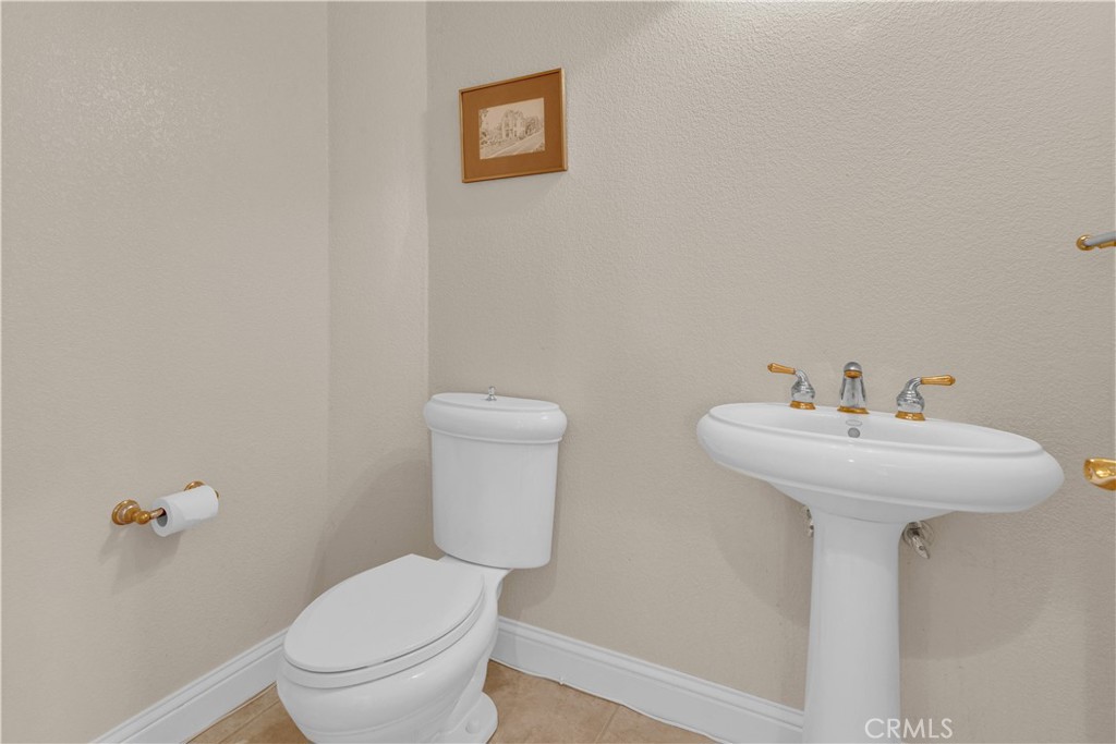 117 Frontier Way Templeton, CA 93465 - Photo 35 of 60 a white toilet sitting next to a white sink