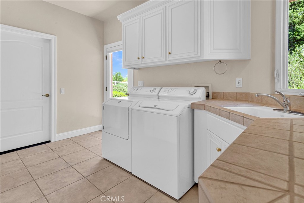 117 Frontier Way Templeton, CA 93465 - Photo 42 of 60 a view of a storage and utility room with washer and dryer
