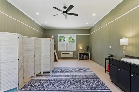 a very nice looking hall with a rug
