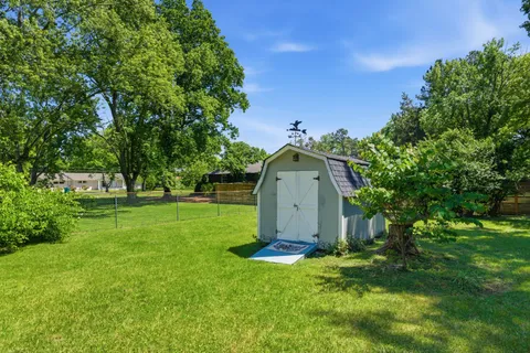 a view of a tiny house with a yard