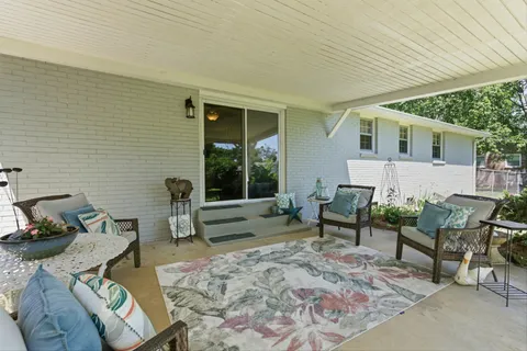 a backyard of a house with seating space