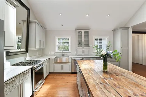 a living room with furniture a refrigerator and a table