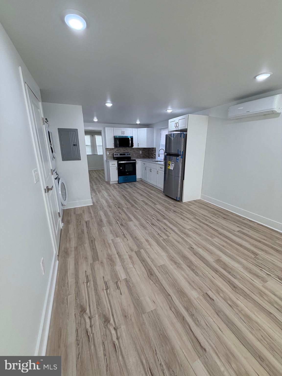 7810 Limekiln Pike, Unit 1 Philadelphia, PA 19150 - Photo 2 of 16 a living room with furniture and a fireplace