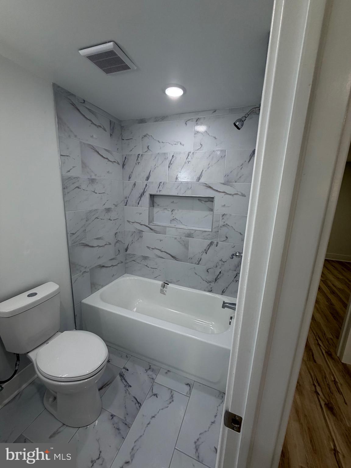7810 Limekiln Pike, Unit 1 Philadelphia, PA 19150 - Photo 7 of 16 a bathroom with a toilet and a shower