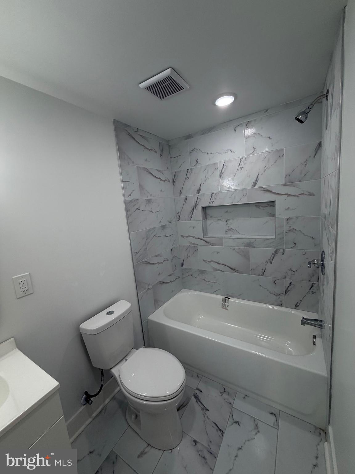 7810 Limekiln Pike, Unit 1 Philadelphia, PA 19150 - Photo 8 of 16 a bathroom with a toilet and a bathtub