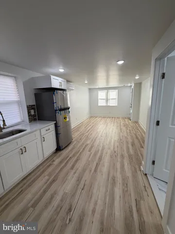 a view of a kitchen with electric appliances