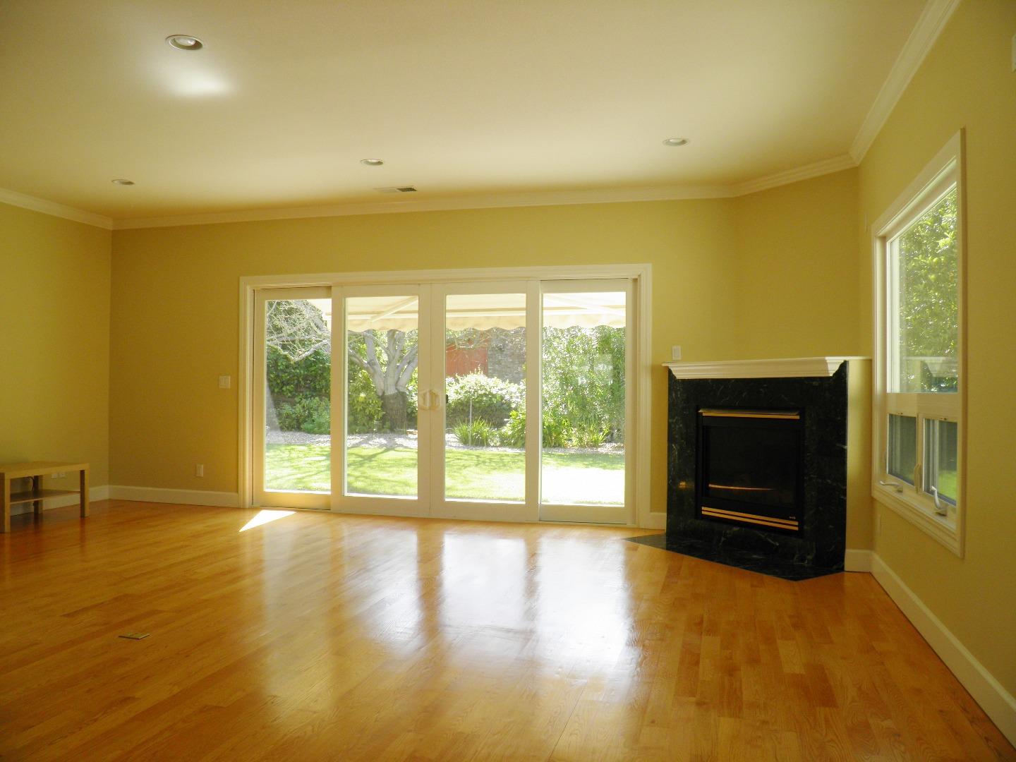 836 Springer Road Los Altos, CA 94024 - Photo 2 of 9 a view of an empty room with a window and wooden floor