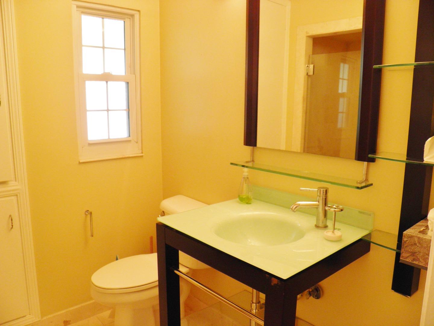 836 Springer Road Los Altos, CA 94024 - Photo 6 of 9 a bathroom with a sink a toilet and mirror