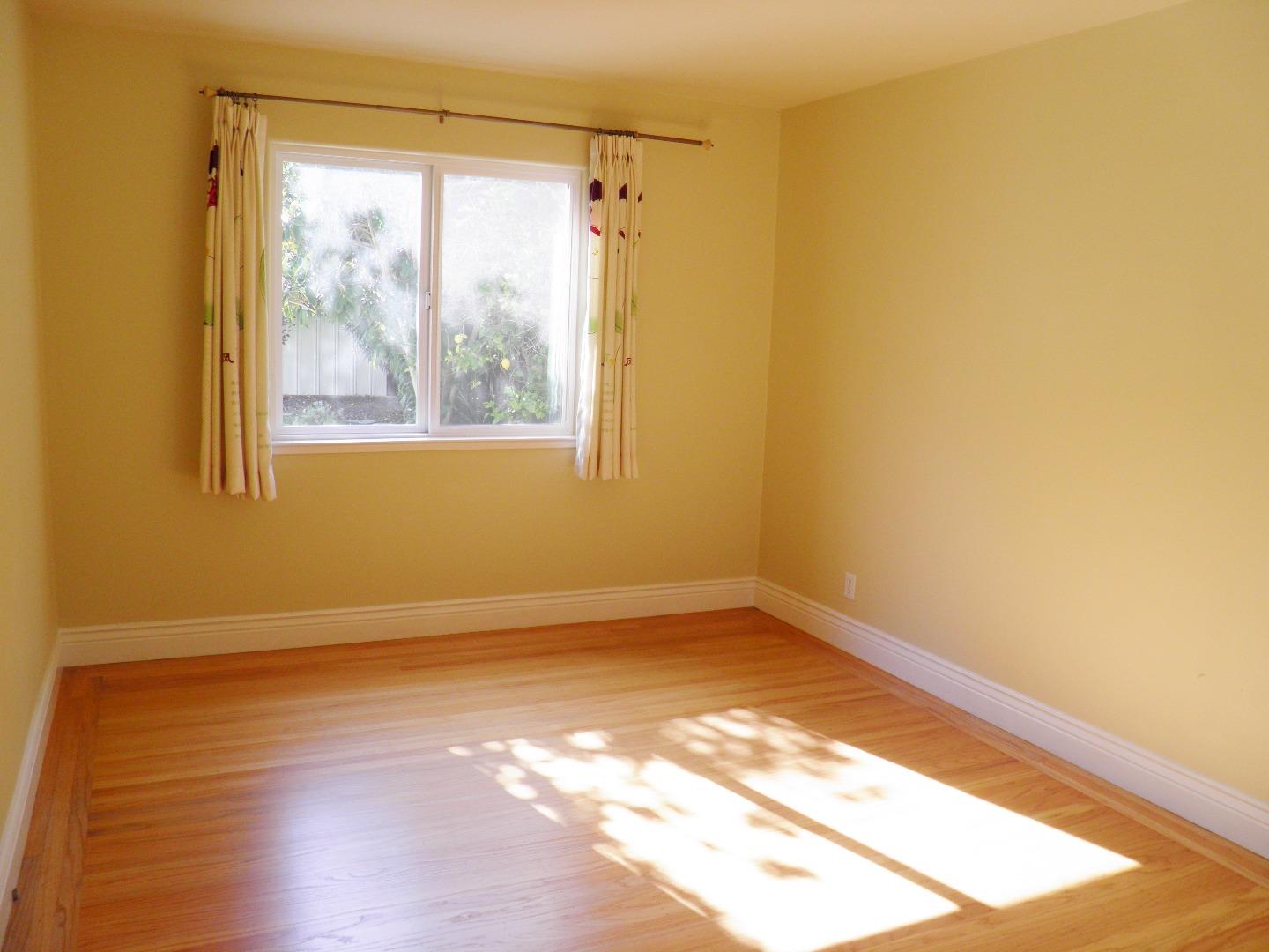 836 Springer Road Los Altos, CA 94024 - Photo 8 of 9 a view of a small space with wooden floor and a window