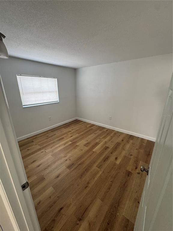 9901 Aquarius Drive, Unit 3 Port Richey, FL 34668 - Photo 12 of 23 an empty room with a window