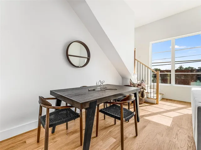 a view of a room that has a table and a chair