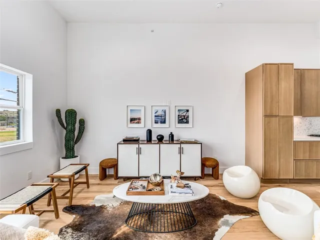 a living room with furniture and a table