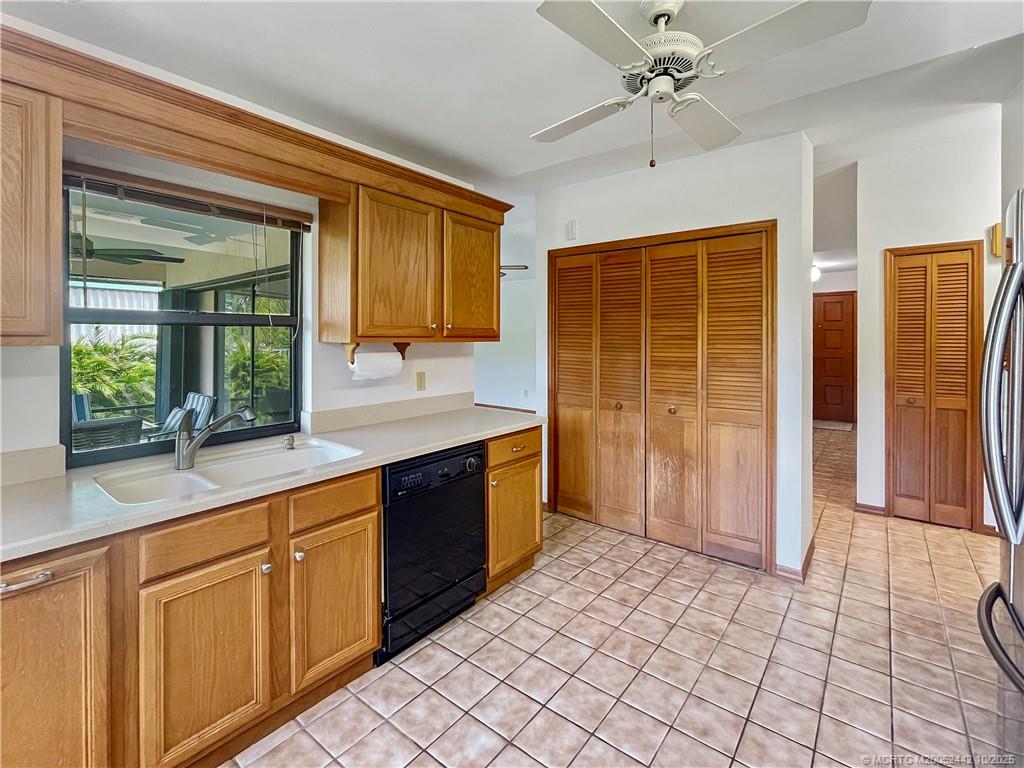 735 Southwest Salerno Road Stuart, FL 34997 - Photo 13 of 27 a large kitchen with cabinets