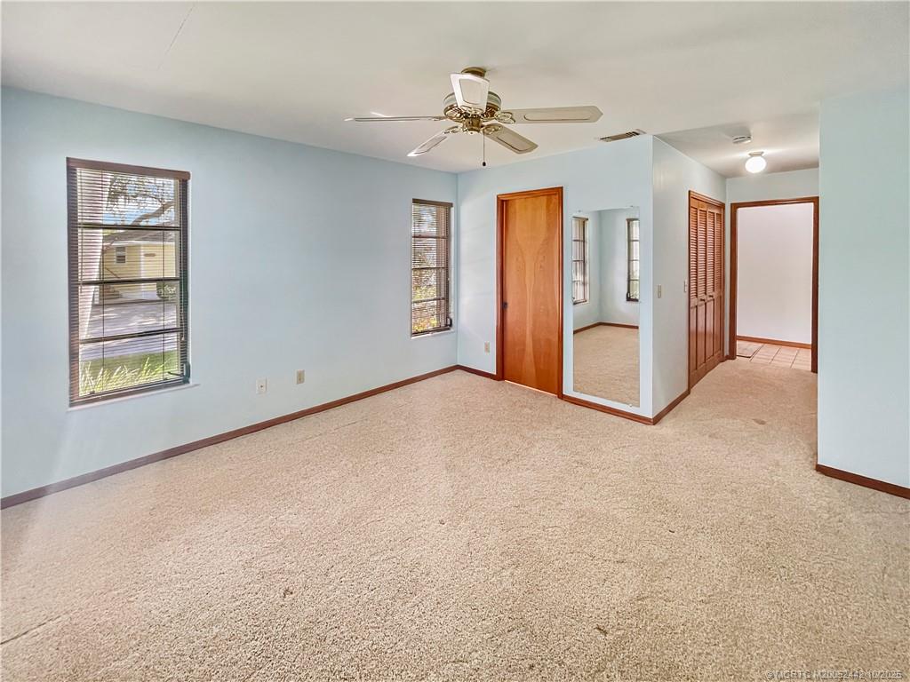 735 Southwest Salerno Road Stuart, FL 34997 - Photo 19 of 27 a view of an empty room with a window