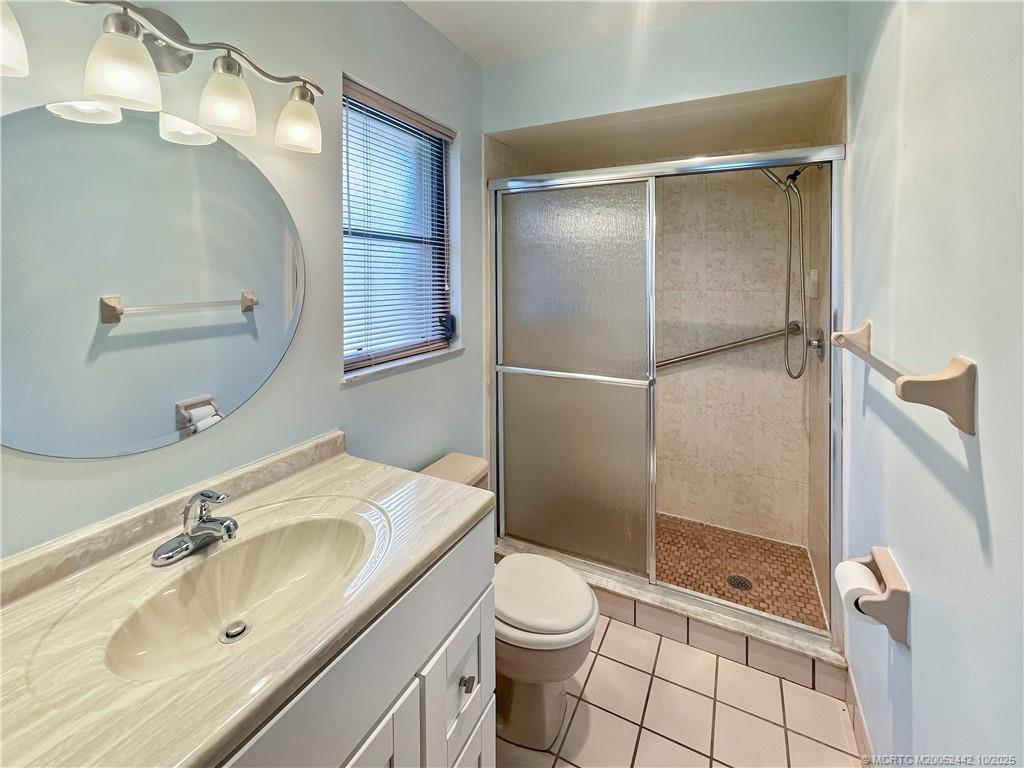 735 Southwest Salerno Road Stuart, FL 34997 - Photo 20 of 27 a bathroom with a sink toilet and shower