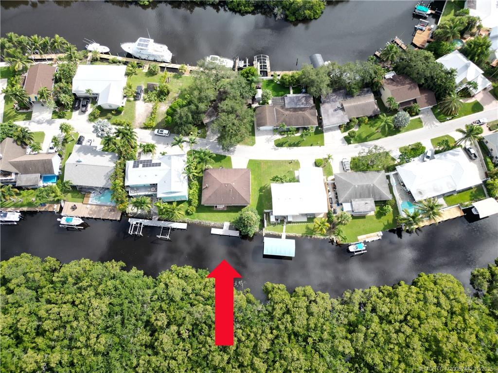 735 Southwest Salerno Road Stuart, FL 34997 - Photo 2 of 27 an aerial view of a houses with yard
