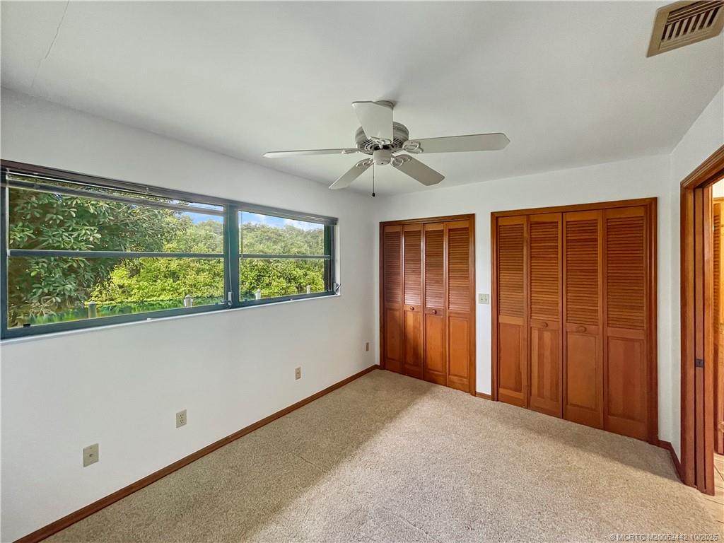 735 Southwest Salerno Road Stuart, FL 34997 - Photo 22 of 27 a view of an empty room with a window