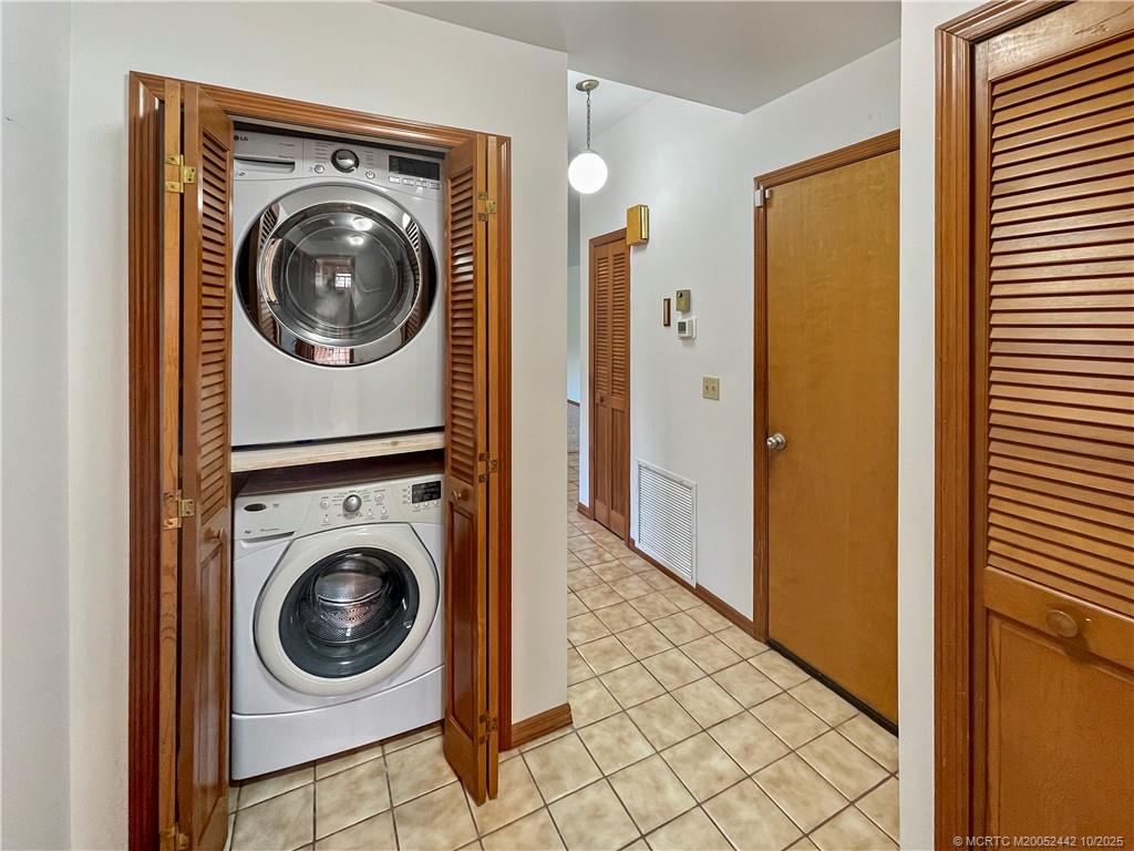 735 Southwest Salerno Road Stuart, FL 34997 - Photo 25 of 27 a view of a hallway with washer and dryer