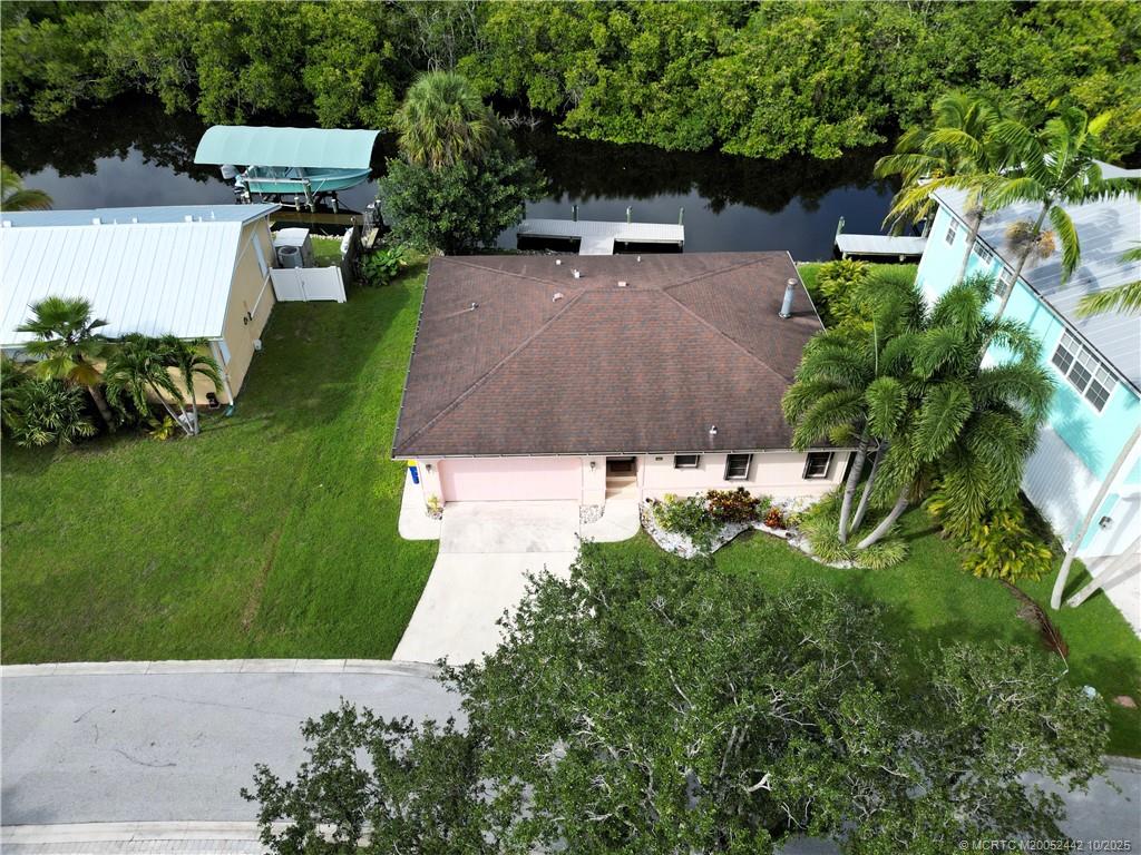 735 Southwest Salerno Road Stuart, FL 34997 - Photo 26 of 27 an aerial view of a house with a garden