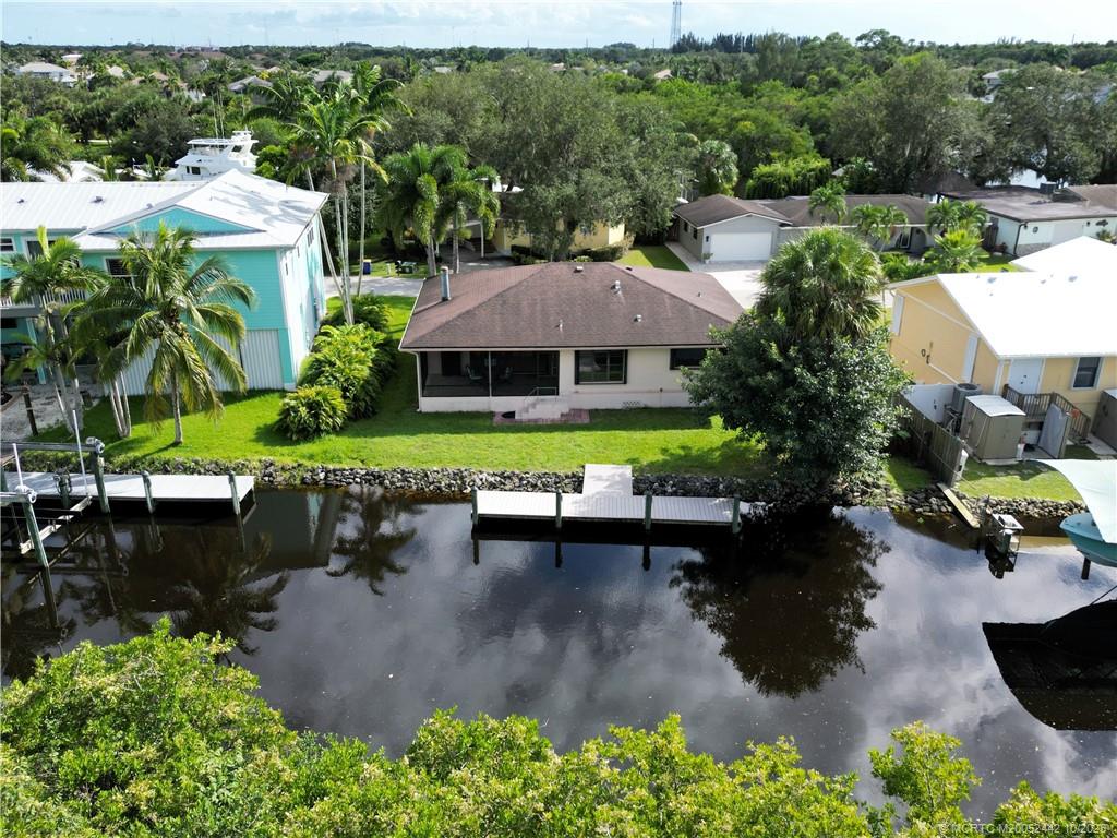 735 Southwest Salerno Road Stuart, FL 34997 - Photo 3 of 27 an aerial view of a house with swimming pool garden and patio