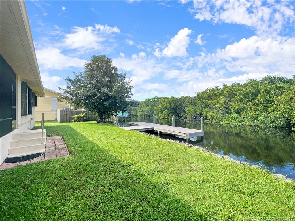 735 Southwest Salerno Road Stuart, FL 34997 - Photo 6 of 27 a view of a backyard with sitting area