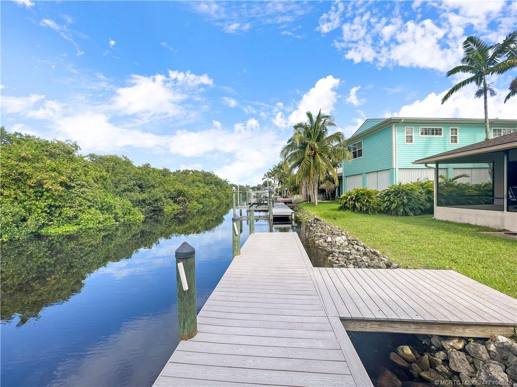 735 Southwest Salerno Road Stuart, FL 34997 - Photo 7 of 27 a view of a house with a yard