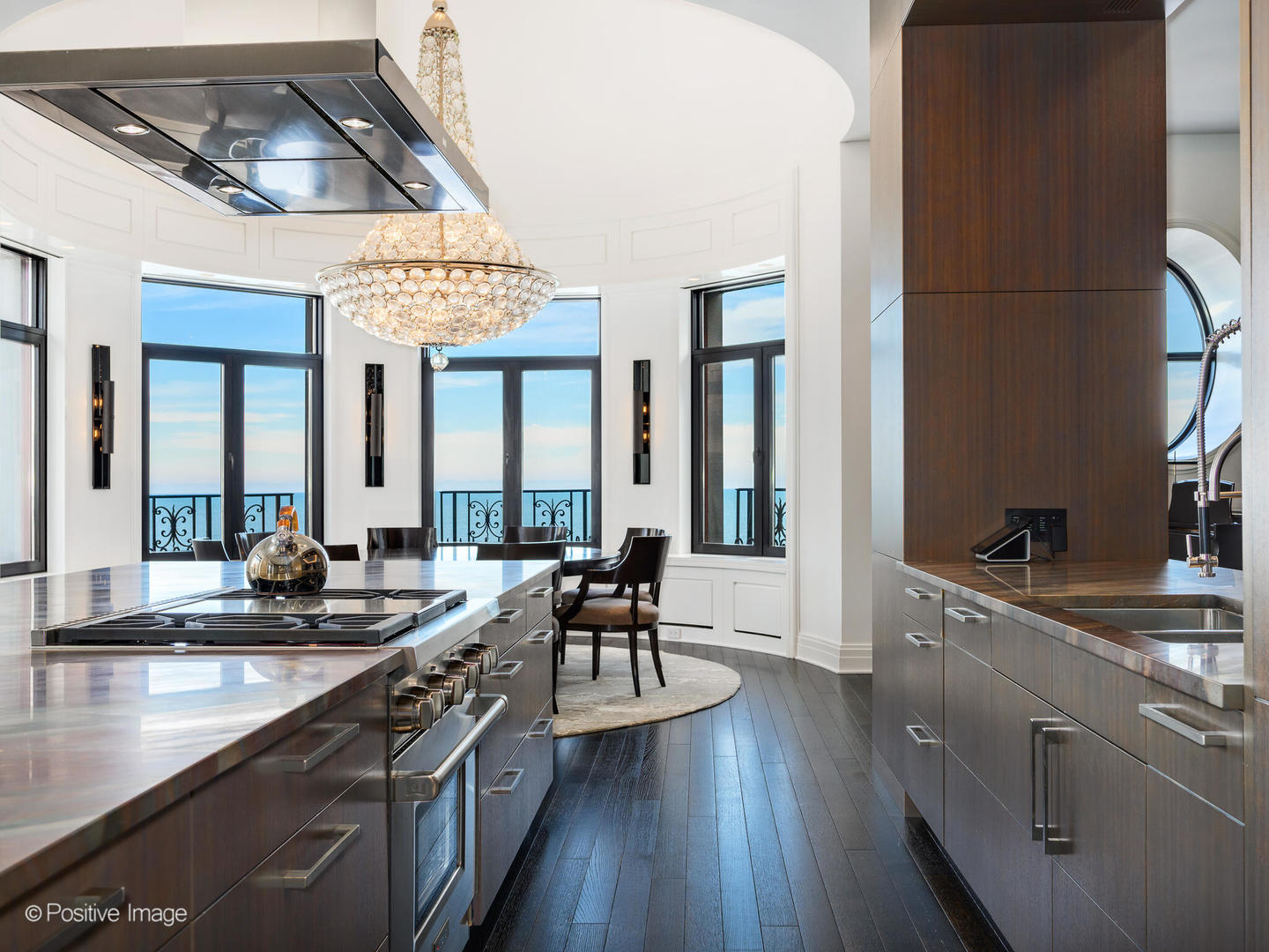 65 East Goethe Street, Unit 8N Chicago, IL 60610 - Photo 14 of 53 a large kitchen with a large window and stainless steel appliances