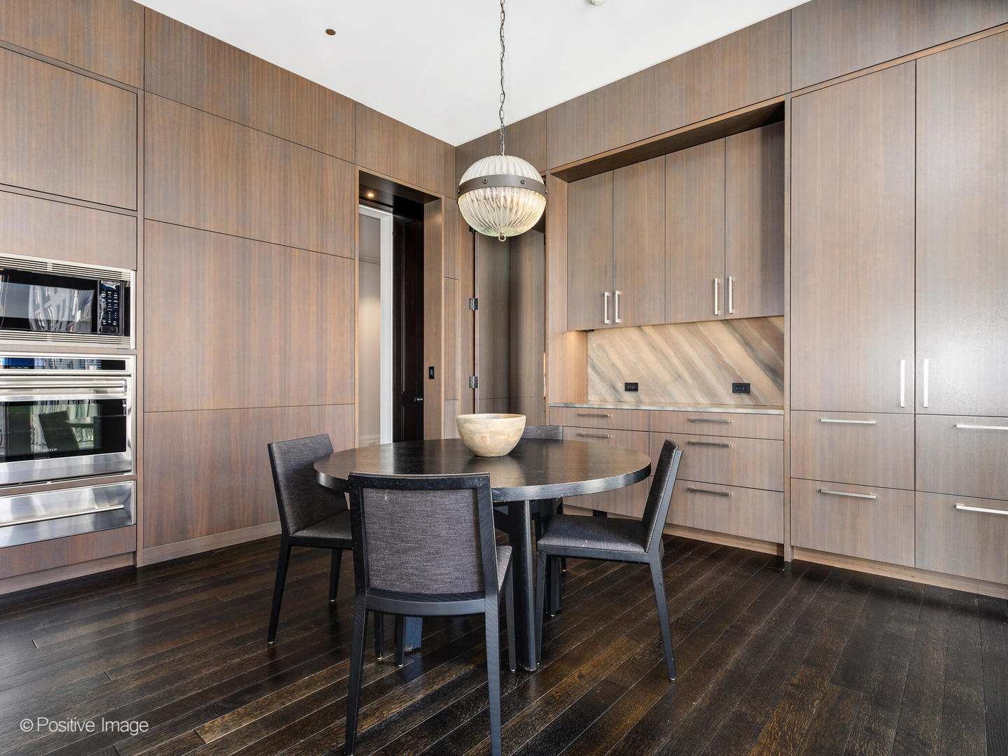 65 East Goethe Street, Unit 8N Chicago, IL 60610 - Photo 15 of 53 a view of a dining room with furniture wooden floor and chandelier