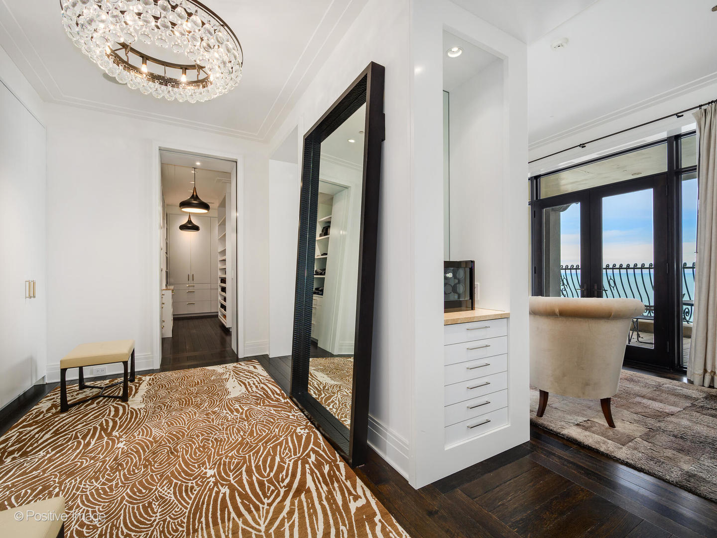 65 East Goethe Street, Unit 8N Chicago, IL 60610 - Photo 22 of 53 a bed room with a bed and a large mirror
