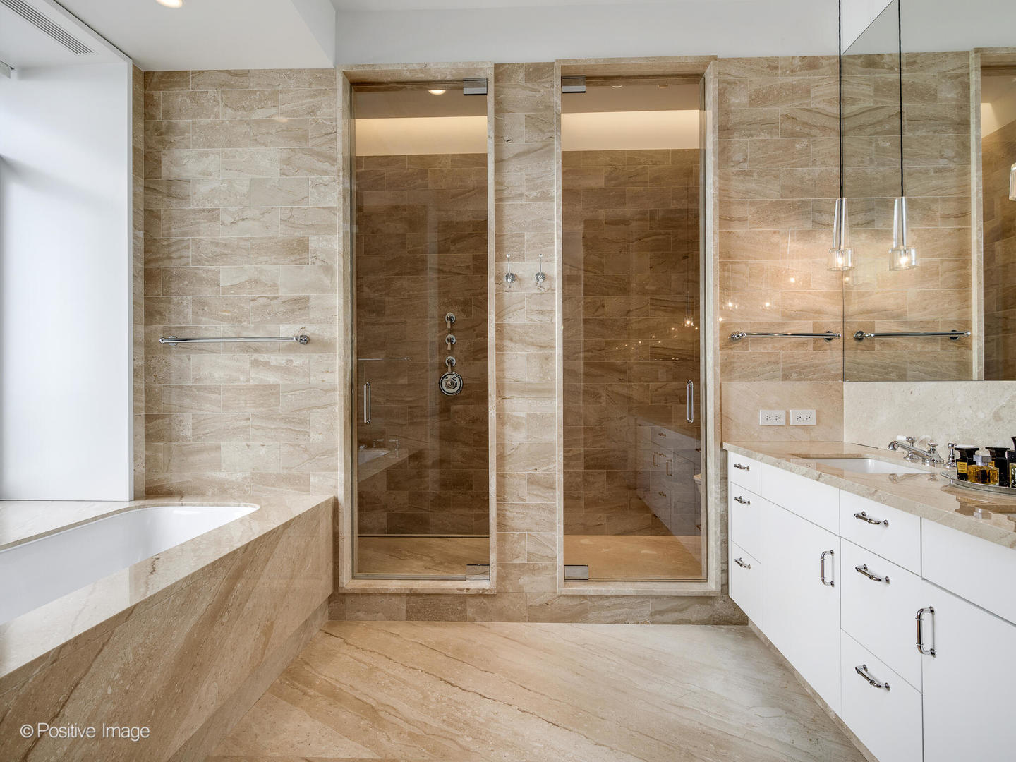 65 East Goethe Street, Unit 8N Chicago, IL 60610 - Photo 26 of 53 a bathroom with a shower and a bathtub