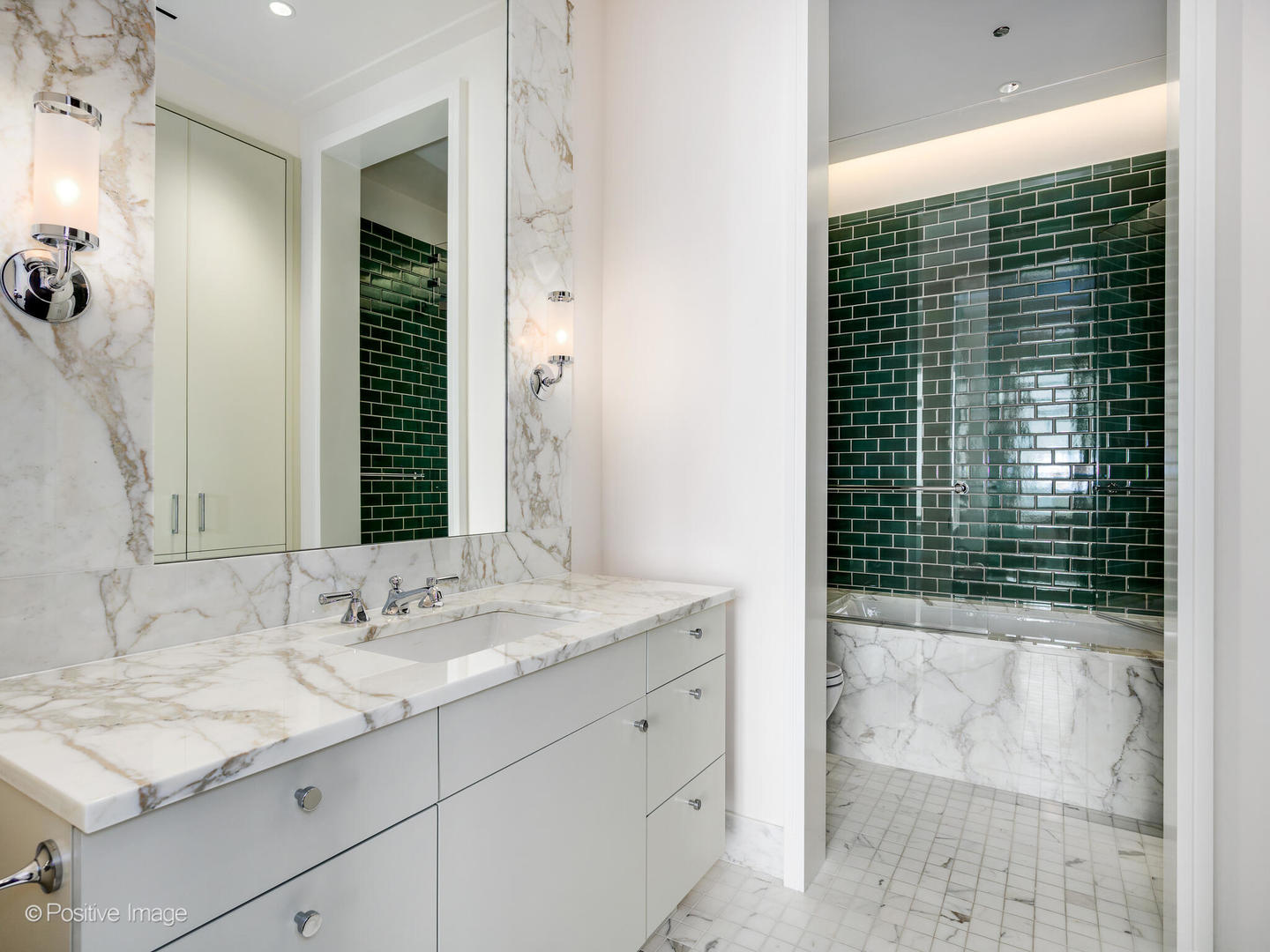 65 East Goethe Street, Unit 8N Chicago, IL 60610 - Photo 29 of 53 a bathroom with a sink and a mirror