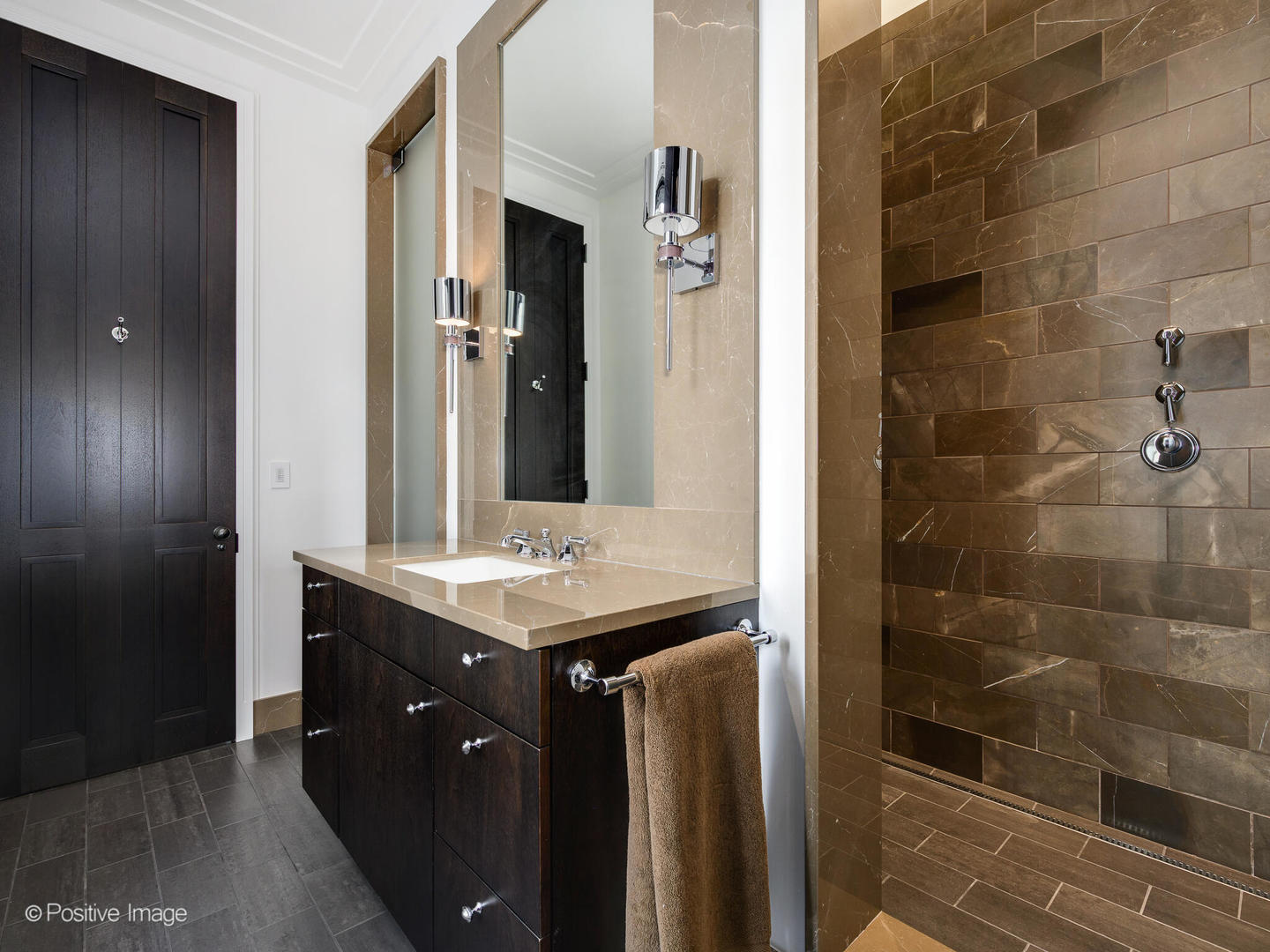 65 East Goethe Street, Unit 8N Chicago, IL 60610 - Photo 34 of 53 a bathroom with a granite countertop sink a mirror and shower