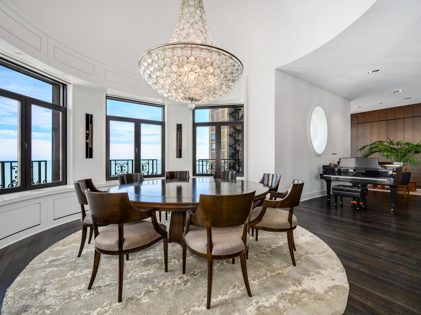 65 East Goethe Street, Unit 8N Chicago, IL 60610 - Photo 5 of 53 a dining room with furniture a chandelier and wooden floor