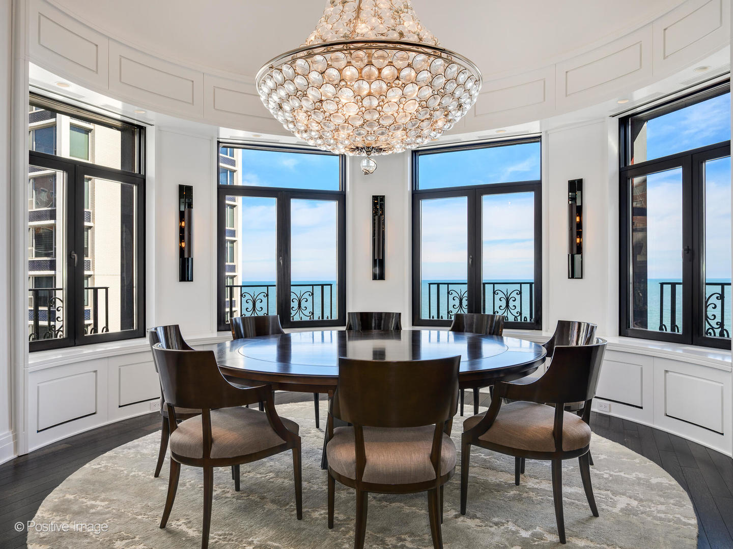 65 East Goethe Street, Unit 8N Chicago, IL 60610 - Photo 10 of 53 a dining room with furniture a chandelier and wooden floor