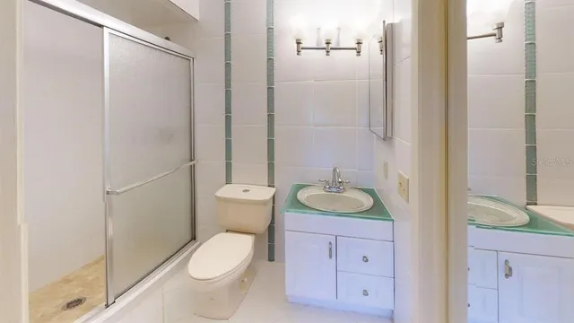 a bathroom with a sink and mirror