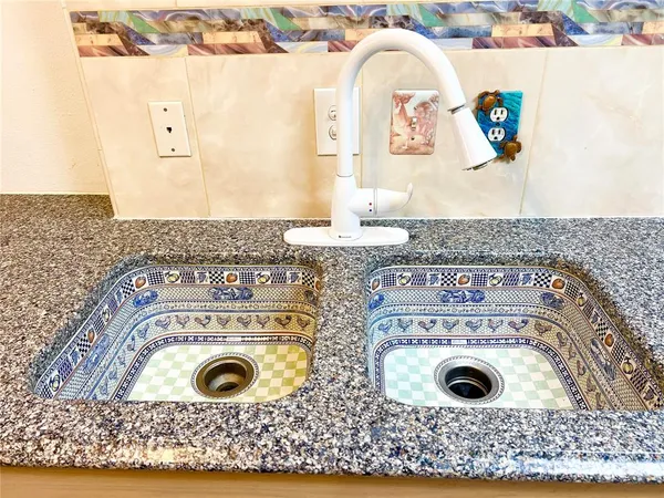 a view of a kitchen from a hallway
