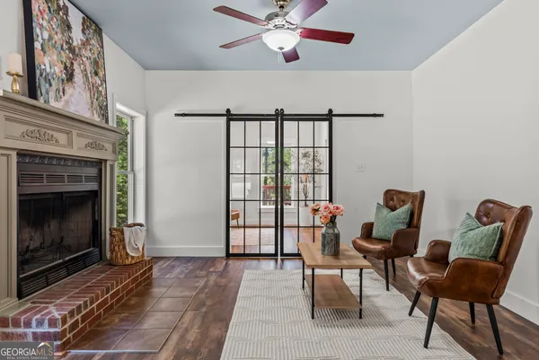 a living room with furniture rug and window