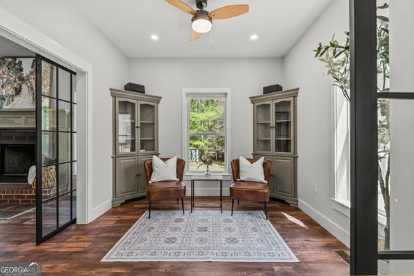 a view of a dining room with furniture window and wooden floor