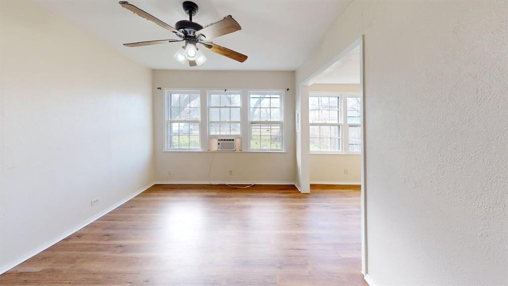 224 West Hull Street, Unit B Denison, TX 75020 - Photo 10 of 13 Unfurnished room with light wood-style flooring and a ceiling fan