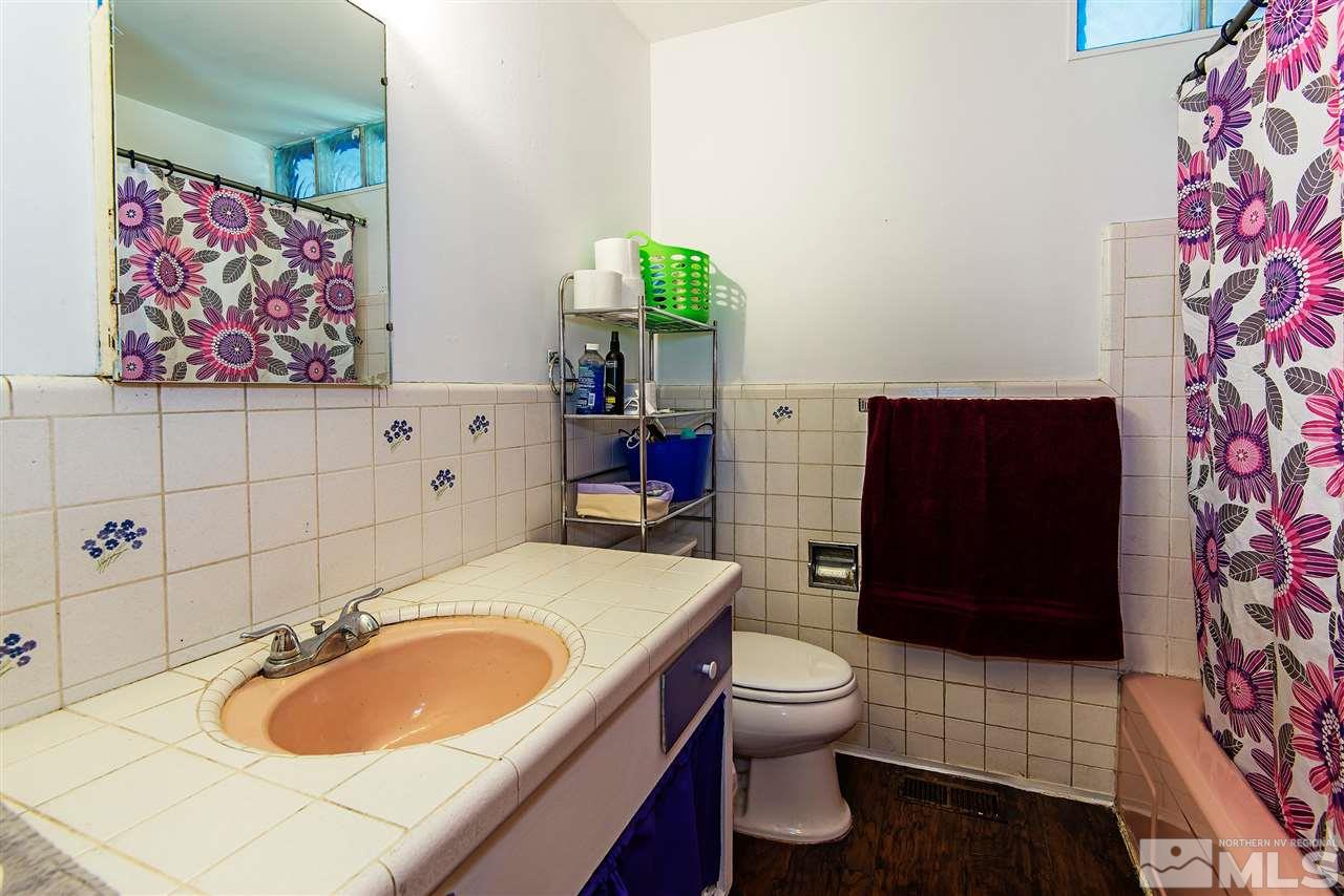 1400 Roberts Street Reno, NV 89502 - Photo 12 of 19 a bathroom with a sink toilet and shower
