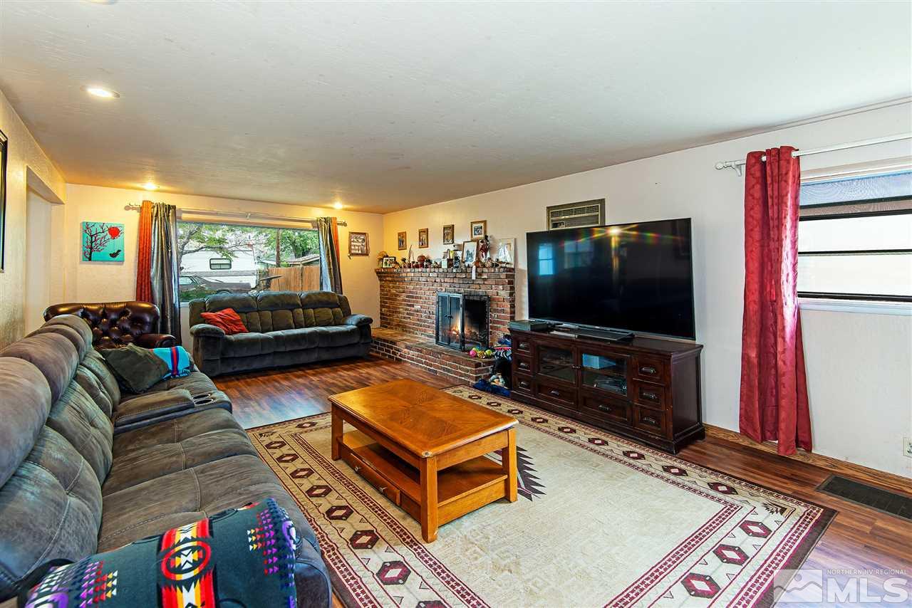 1400 Roberts Street Reno, NV 89502 - Photo 2 of 19 a living room with furniture and a flat screen tv