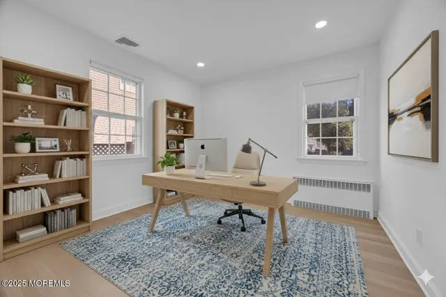 a view of a workspace with furniture