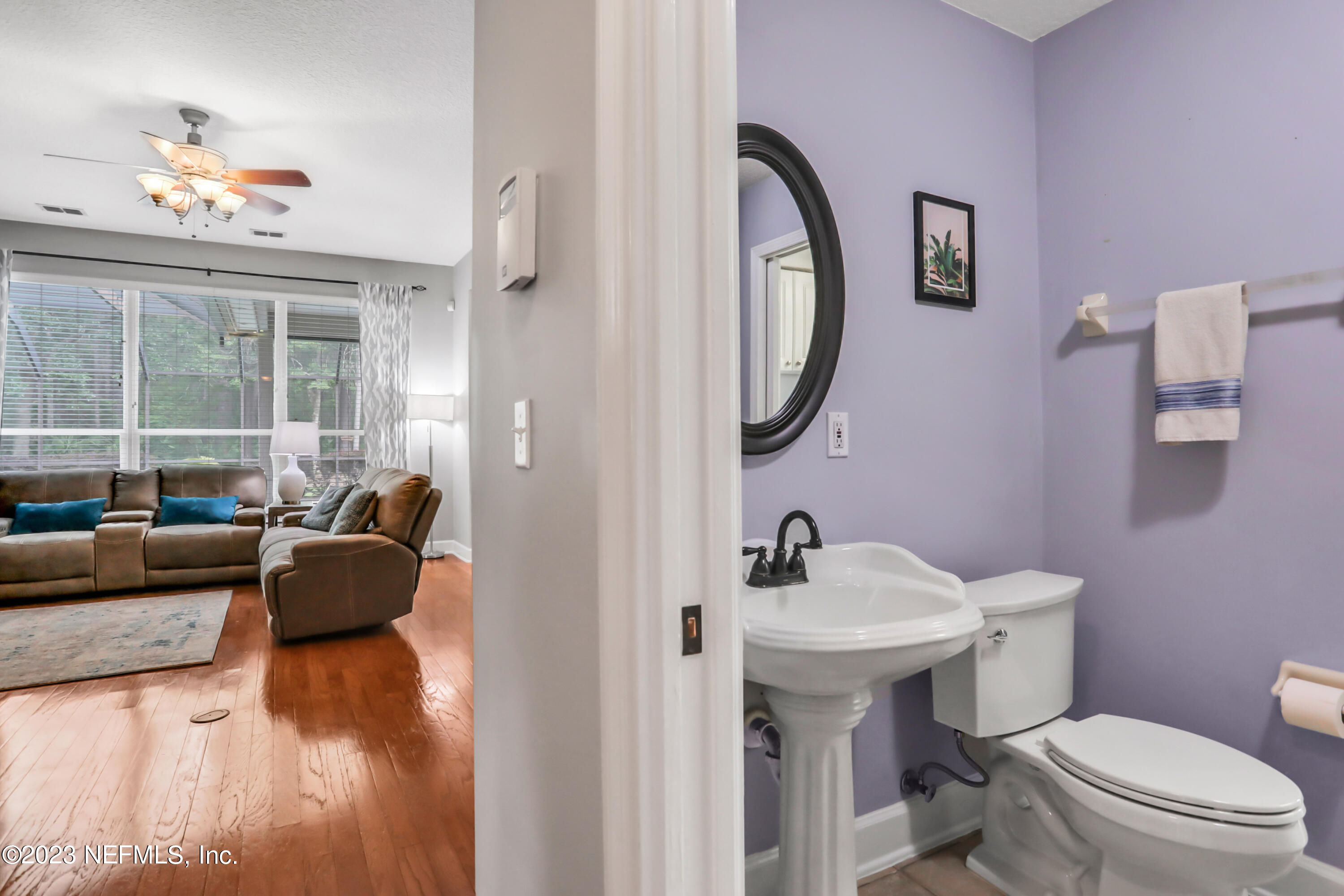 212 Twining Trace St. Johns, FL 32259 - Photo 17 of 60 a bathroom with a toilet sink and mirror