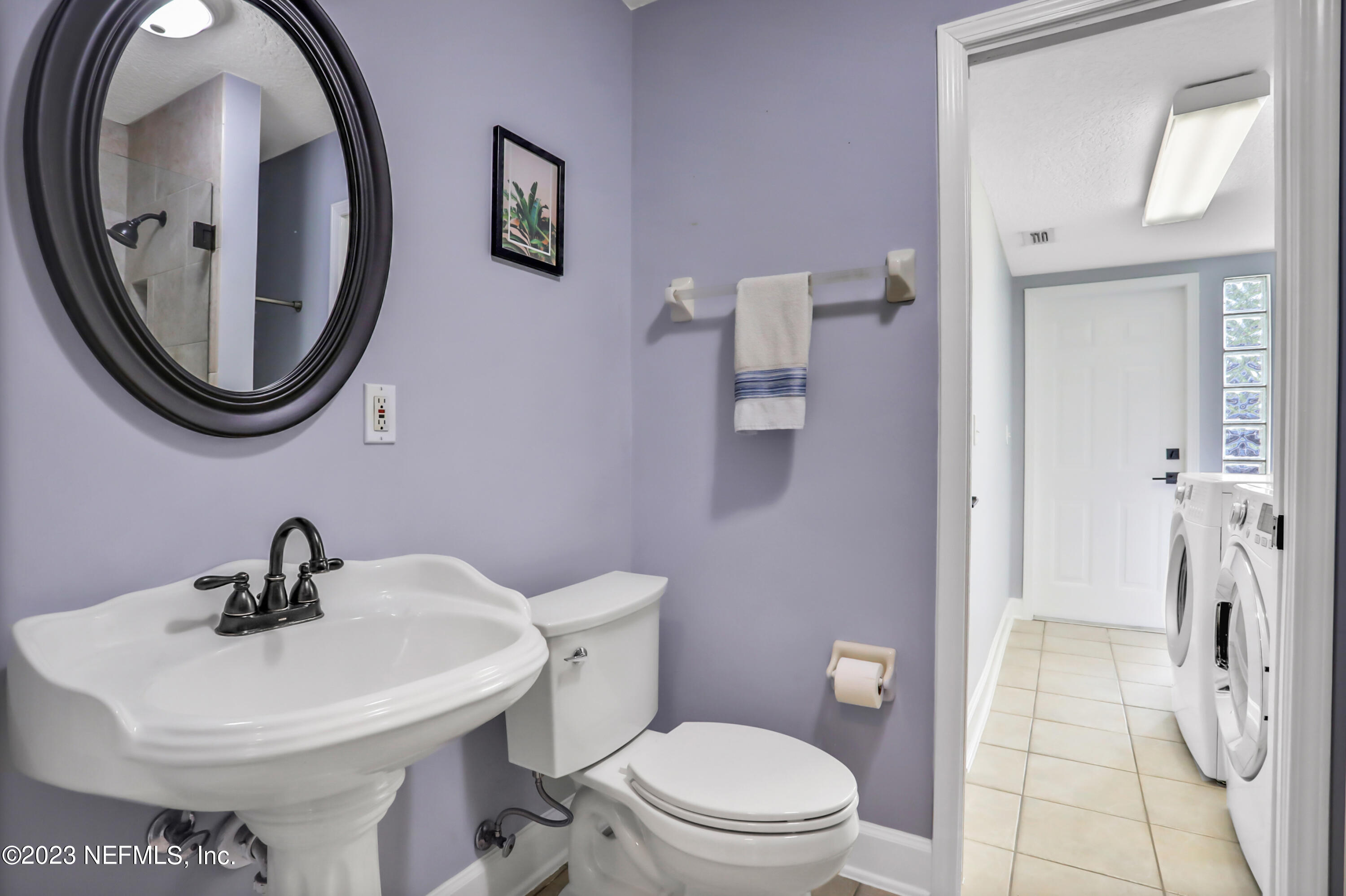212 Twining Trace St. Johns, FL 32259 - Photo 18 of 60 a bathroom with a toilet a sink and a mirror