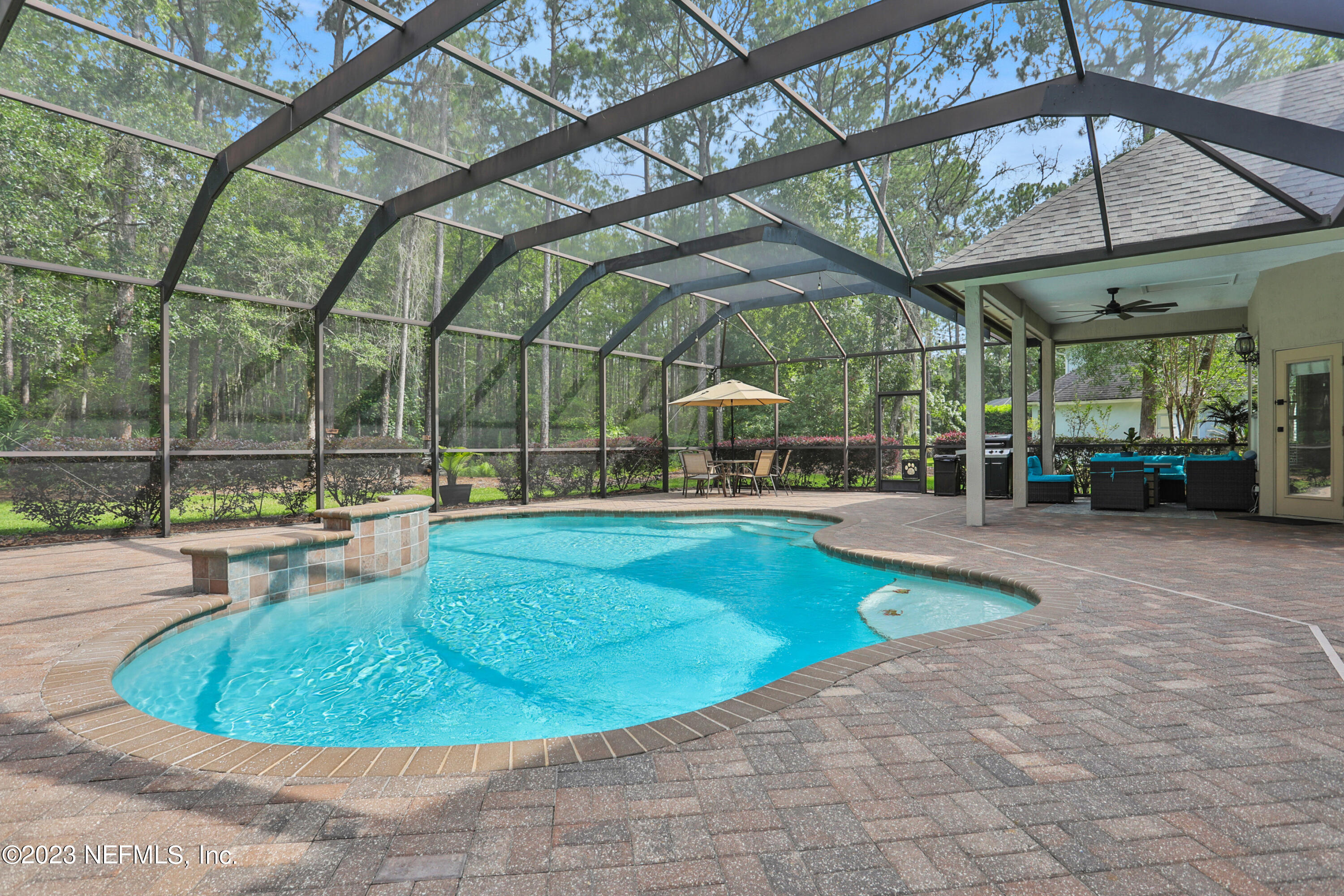 212 Twining Trace St. Johns, FL 32259 - Photo 2 of 60 a view of a swimming pool with a patio