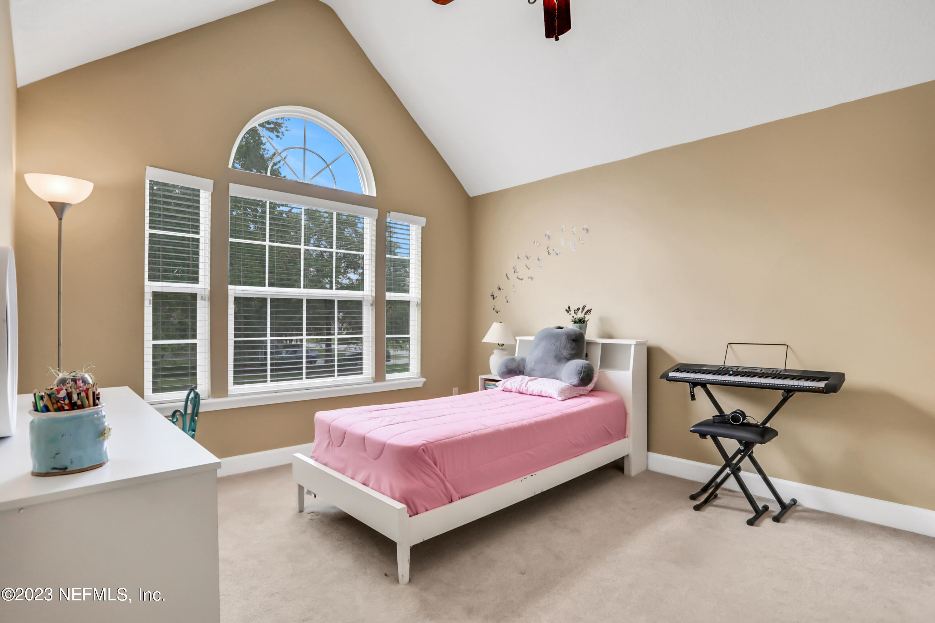 212 Twining Trace St. Johns, FL 32259 - Photo 26 of 60 a bedroom with a bed a table and chair